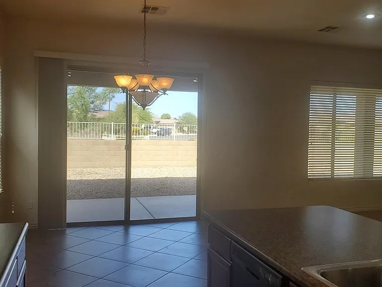 OPENS TO FULL LENGTH COVERED PATIO.