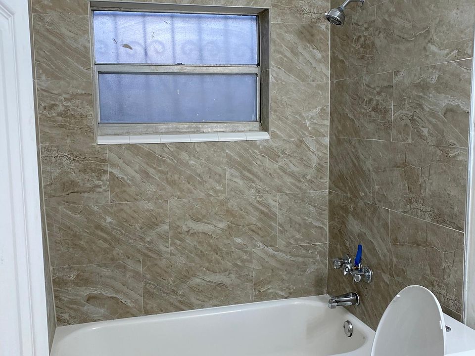 Newly remodeled full bath with new bath tub / shower- Toilet seat and vanity