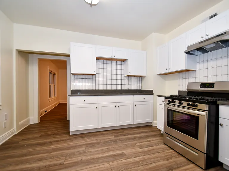 Spacious renovated eat in kitchen with pantry.