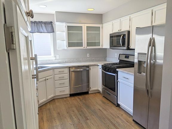 Light and bright kitchen with all new appliances and hardwood floors