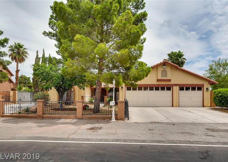 front exterior of home fully gated