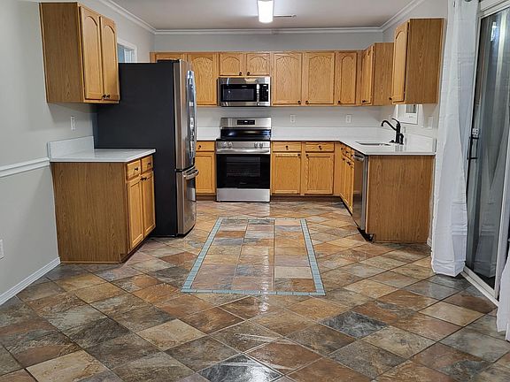 New quartz countertop, new stainless steel appliances, and new cabinet hardware