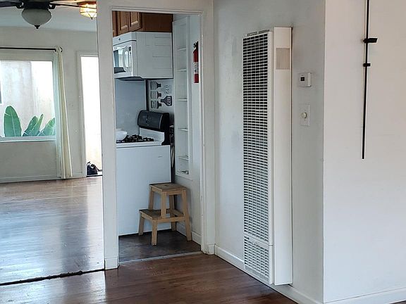 Living room and kitchen in the background