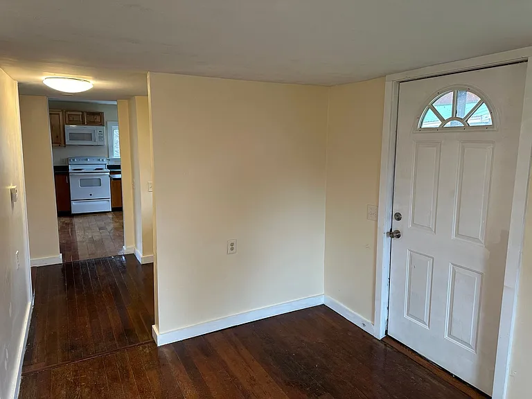 living room/ hallway/ door to outside