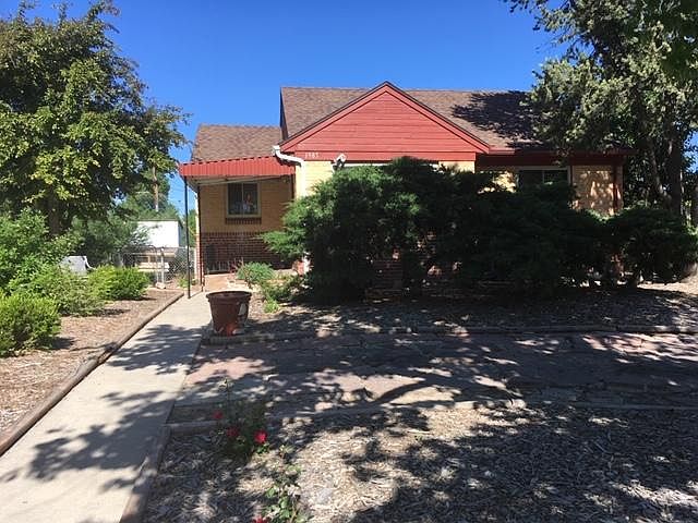 Front of House with curved flagstone drive for off street parking