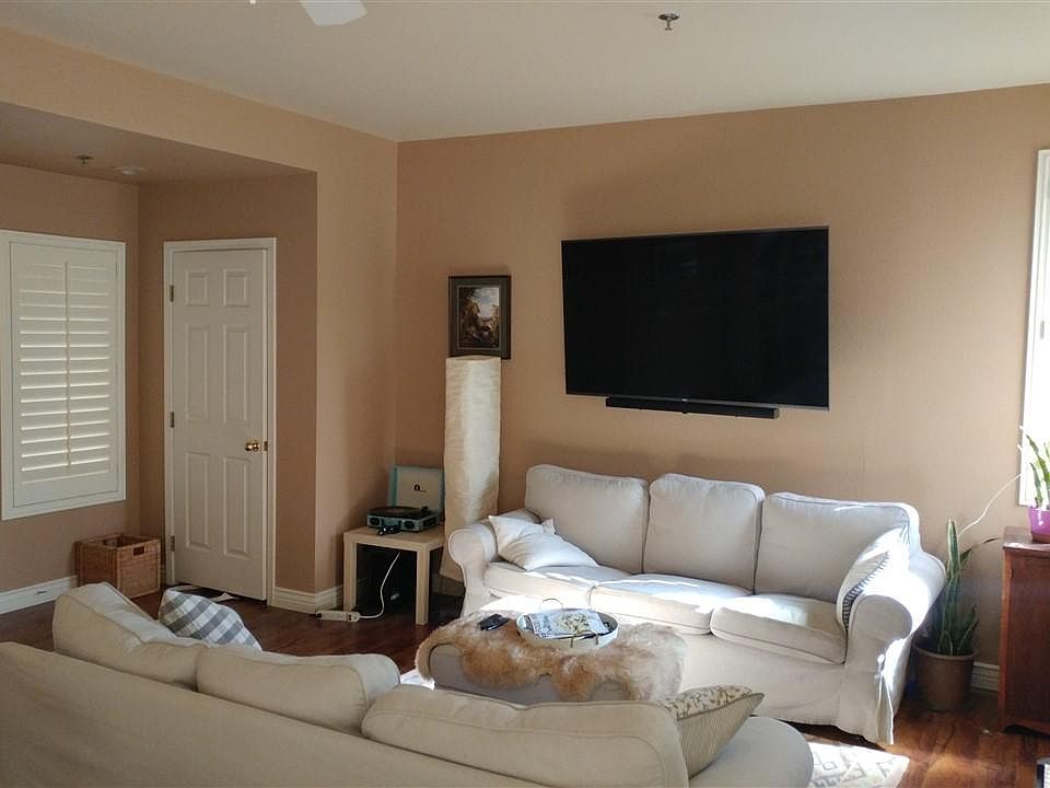 Front entrance and living room, including TV and sound-bar (