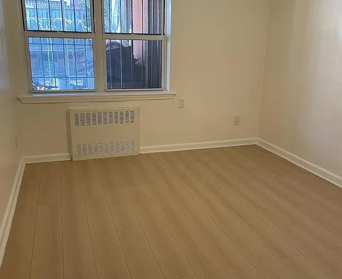 bedroom 2 that can comfortable fit a queen bed with a dresser