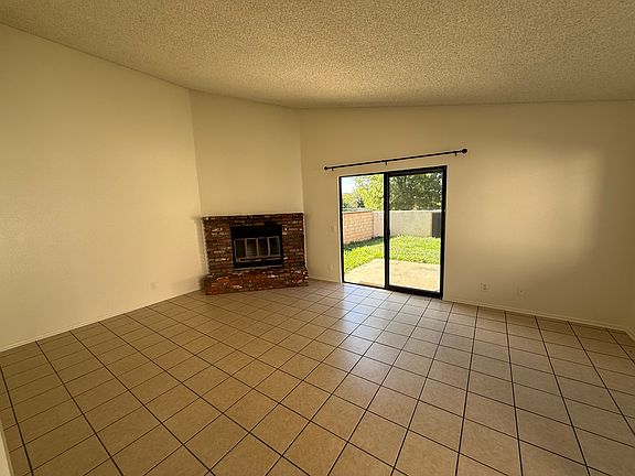 Living room, with slider to back yard with green grass