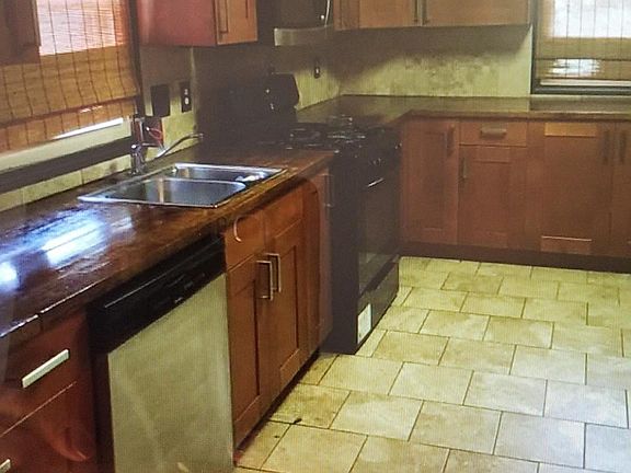 Kitchen appliances has been updated to "Stainless steel dishwasher, refrigerator, microwave. Black range still remains purchased 2017.