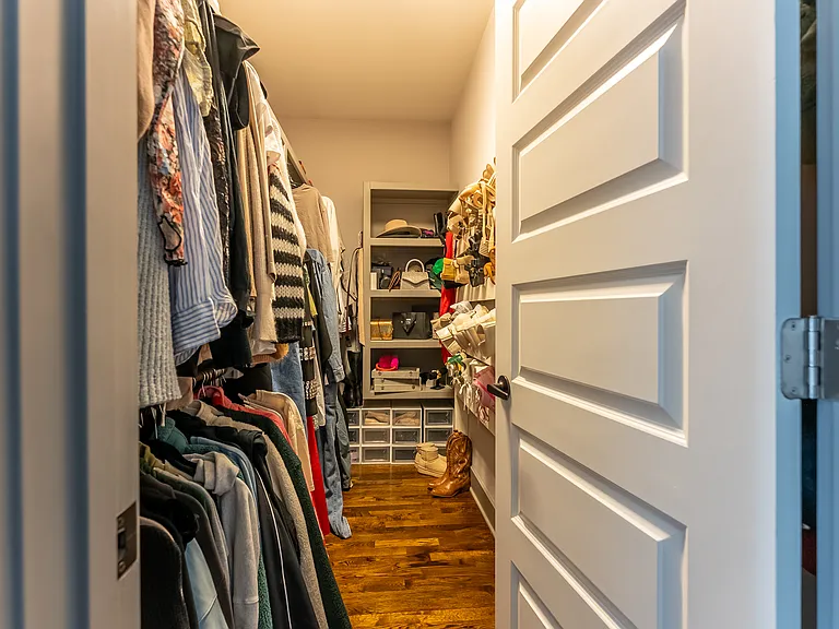 Walk in closet in primary bedroom
across from another closet