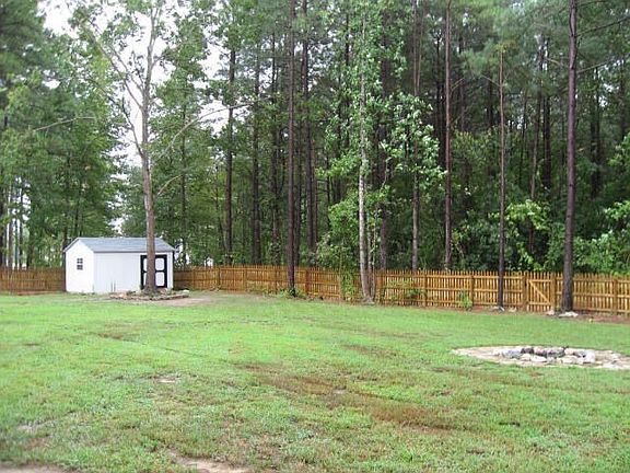 Yard soes not end at the fence. Large storage building is a bonus.