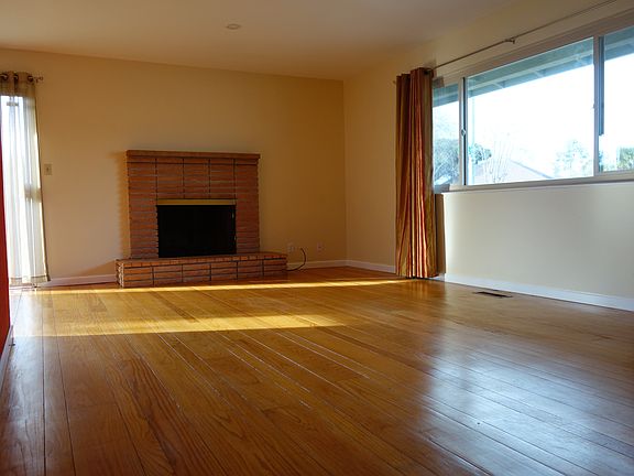 living room with wood burning firplace