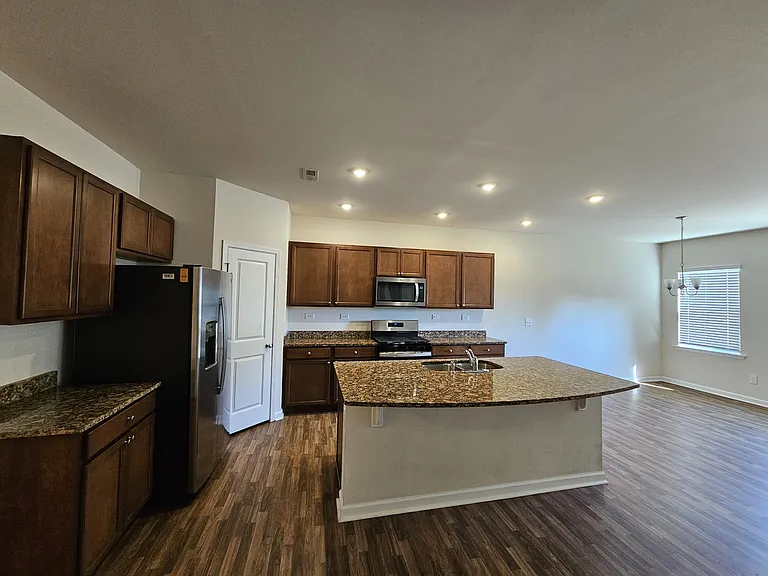 Kitchen with large island and stainless steel appliances
