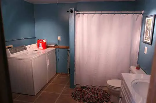 Downstairs bathroom with laundry.