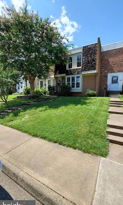 Nice front yard with beautiful tree.