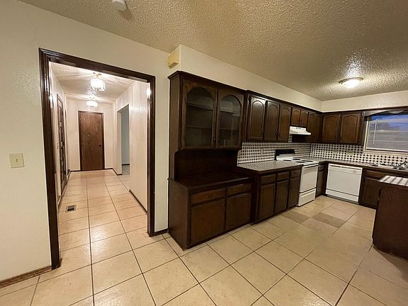 Kitchen view through hallway to bedrooms/bathroom