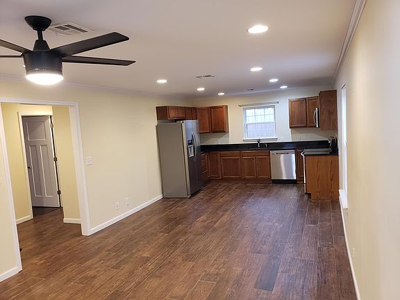 Open Concept Living Space Looking into Hall that Leads to Bedrooms
