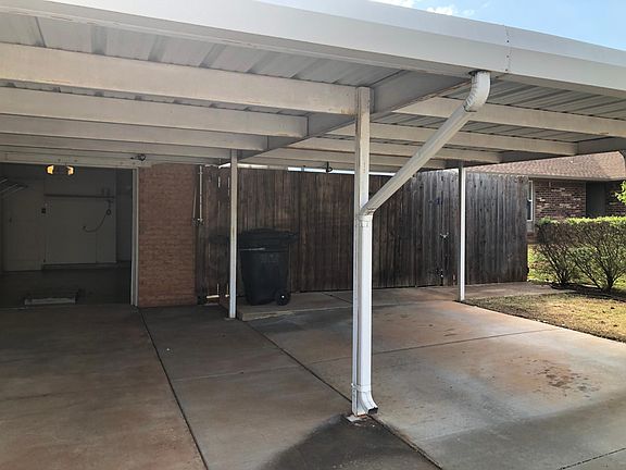 Partial view of 3 car covered parking