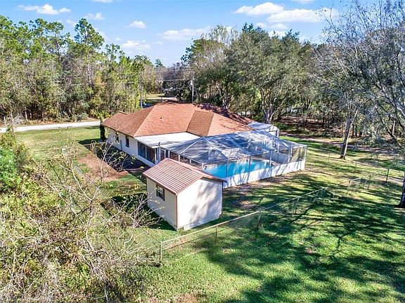 Backyard view. This property has 2 additional SmithBuilt sheds for all of your hobbies and extra needs. Have a He-she or She-she