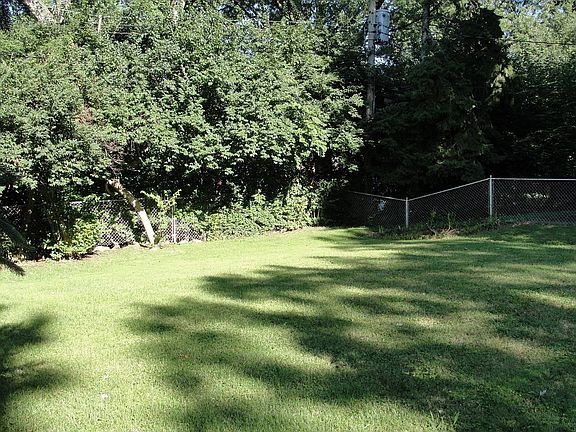 Beatiful,treed backyard.