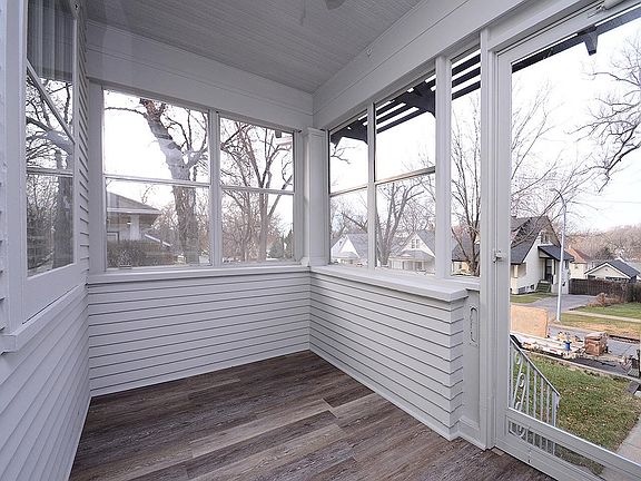 Enclosed front porch, great for morning coffee.