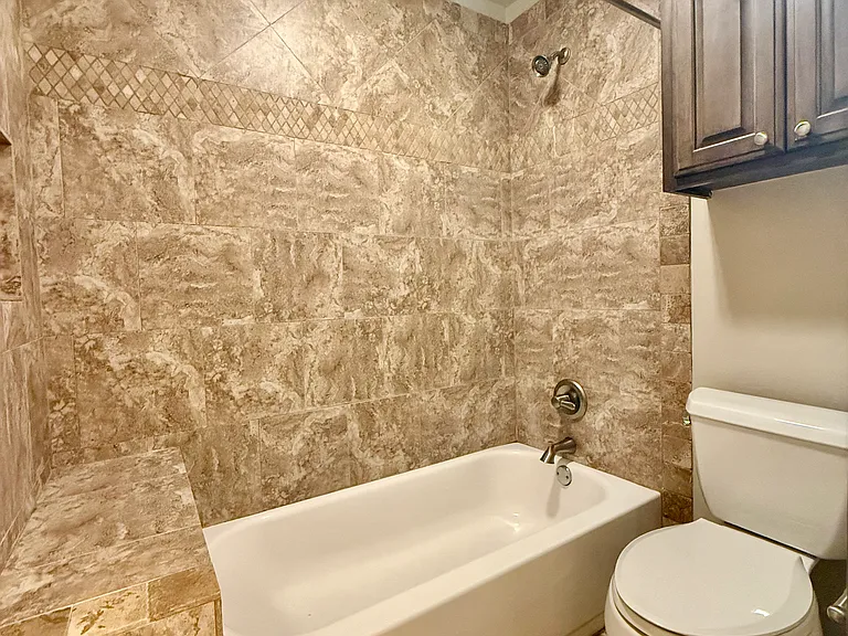 Pick your favorite shower curtain. More storage above the shower/tub. Beautiful tile and a crisp clean look! I love this new color picked for the home. A neutral color that can be used with any decor.