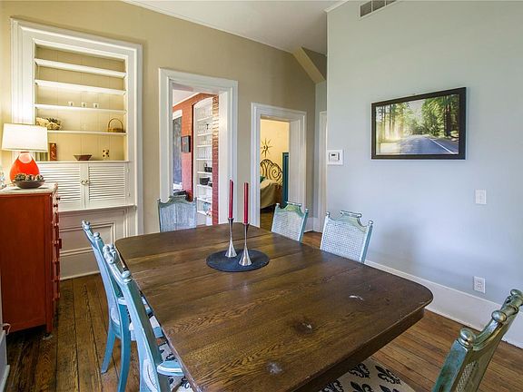 Over-sized dining room with built-in shelves and space for a large family table. Perfect for entertaining or enjoying an intimate family night.