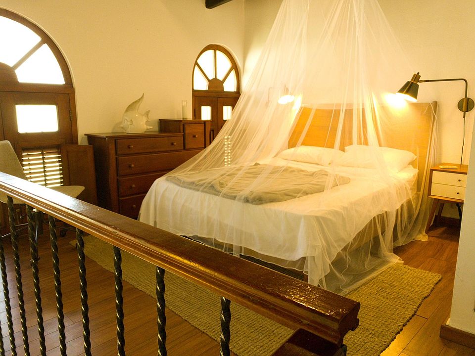 The cozy upstairs loft bedroom with all its period charm.