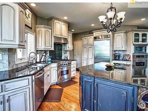 Beautiful fixtures through out the home, kitchen access to laundry room, bathroom, and 3 car garage.