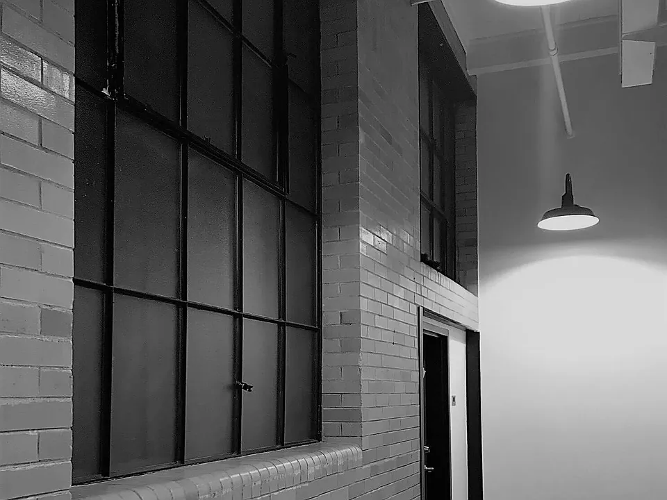 Original windows and brickwork at public hallway