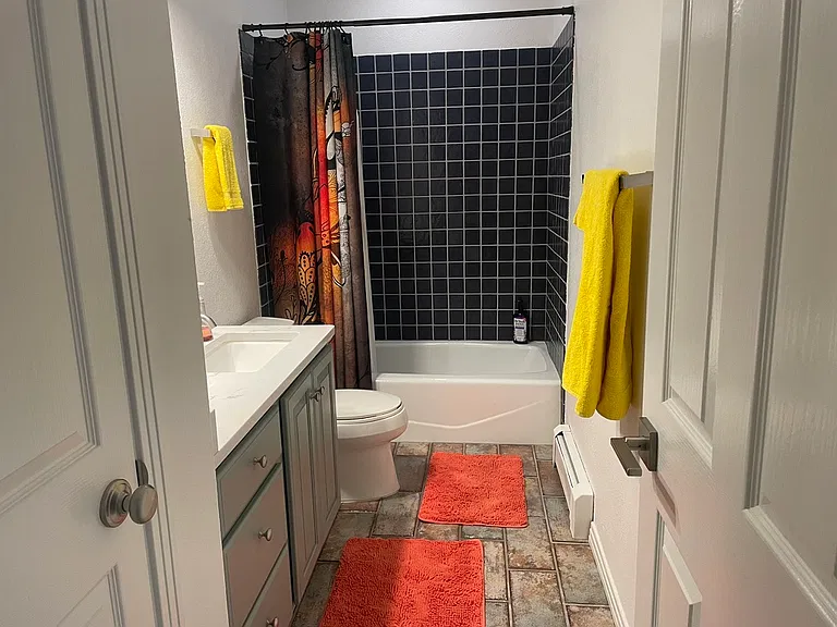 Primary bathroom - en suite. Shower, tub, and large linen closet.