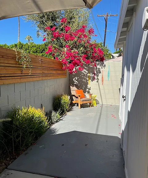 Private back patio showing doors to laundry and storage rooms. Not shown is pathway to the pool and courtyard.