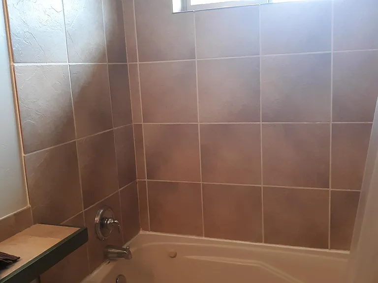 Full private bath in rear master suite.