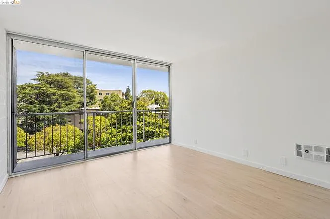 Floor-to-ceiling windows from the bedroom to the balcony.