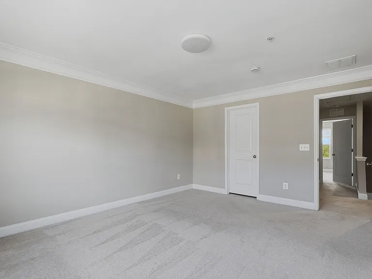 3rd-floor primary bedroom with two closets.