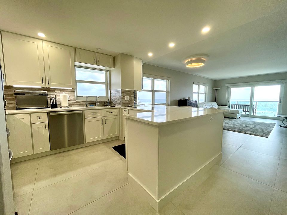Fully equipped kitchen into living room.