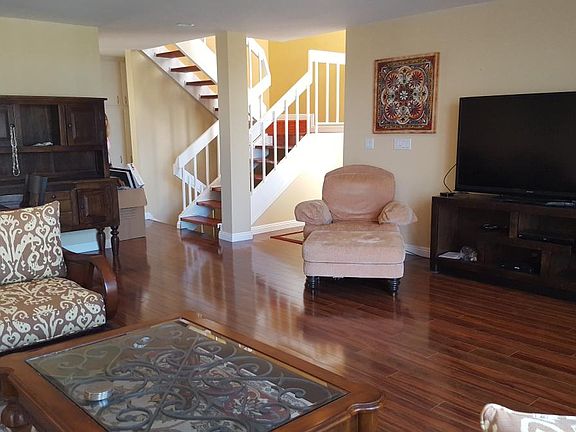 Living room with stairs to next level