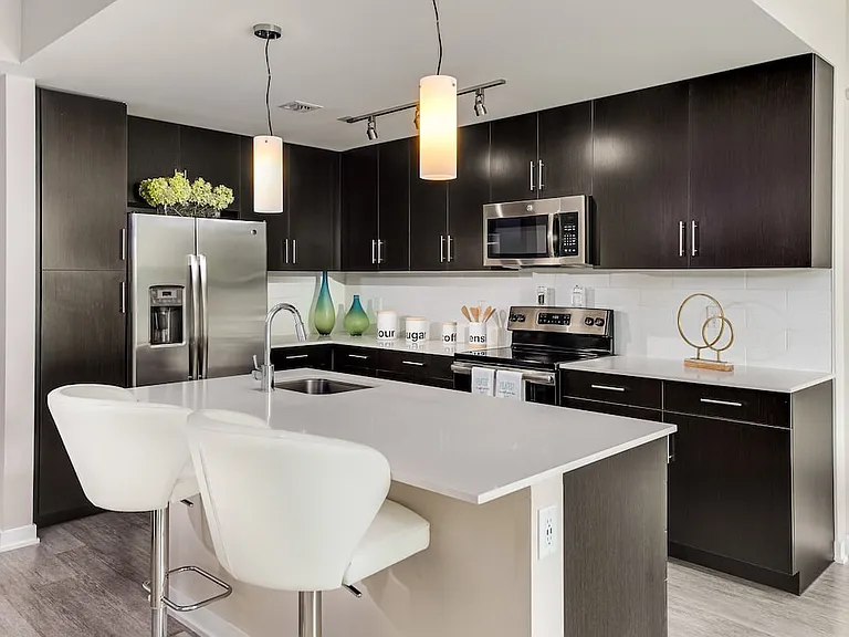 Tower Building kitchen with stainless steel appliances and kitchen island