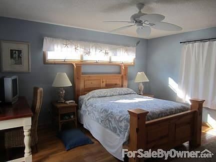 Large flat screen tv and decks off both rooms.