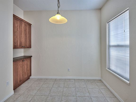 A cabineted dry bar is tucked into an alcove in the dining area!