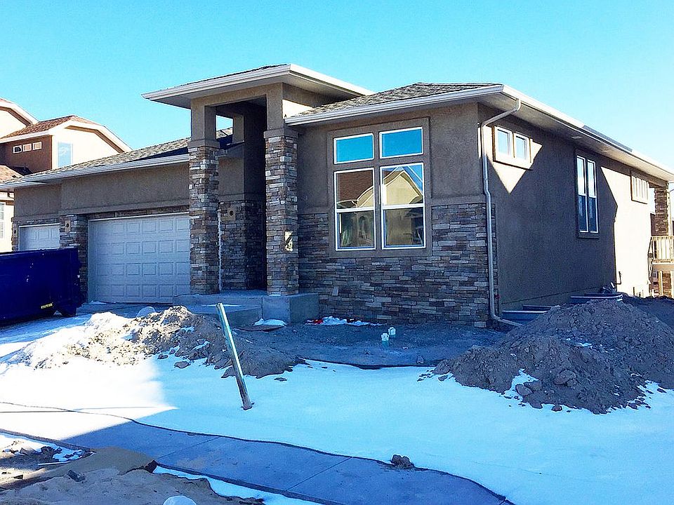 Stucco & stone front elev.