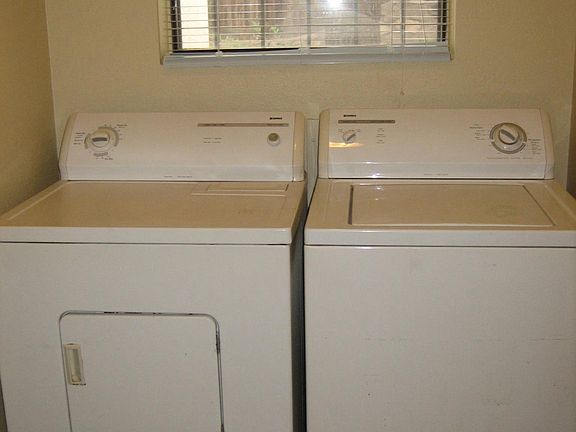 Separate laundry room with washer and dryer included in the 