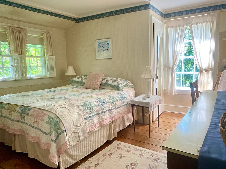 This is the east bedroom with desk/bureau unit and large closet