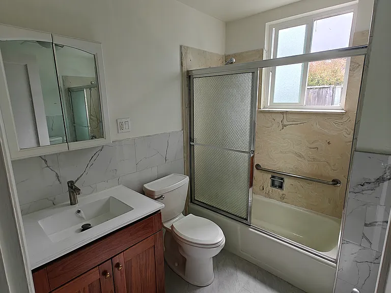 bathroom with tub, new counter, tiles, floor