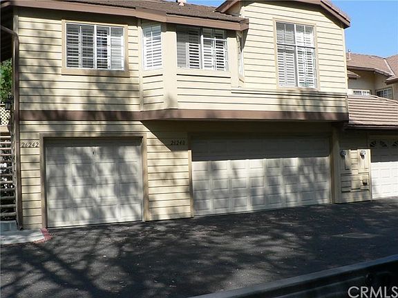 Enter around the left of the building. The two car garage is this properties. The front with the shu