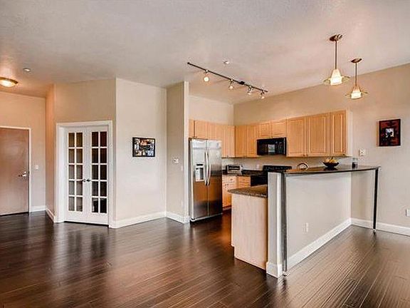 Kitchen, entry, french doors to second bedroom/office.