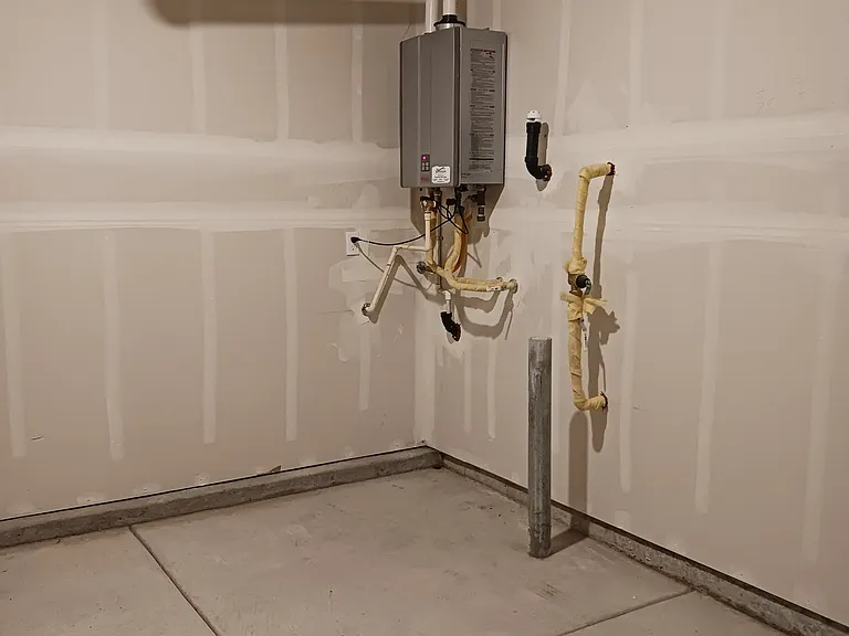On-demand water heater. Part of tandem garage