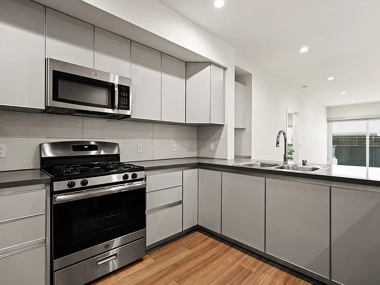 Kitchen with Energy-Efficient Appliances and Ample Cabinet Storage