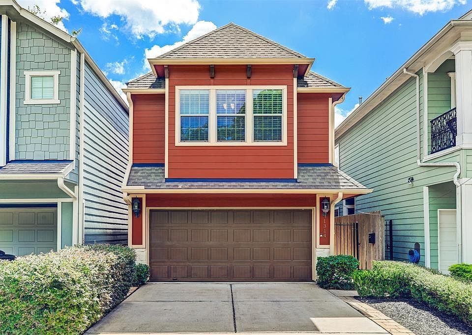 Come live in the heart of the Heights. First floor living with a private driveway and two car garage!