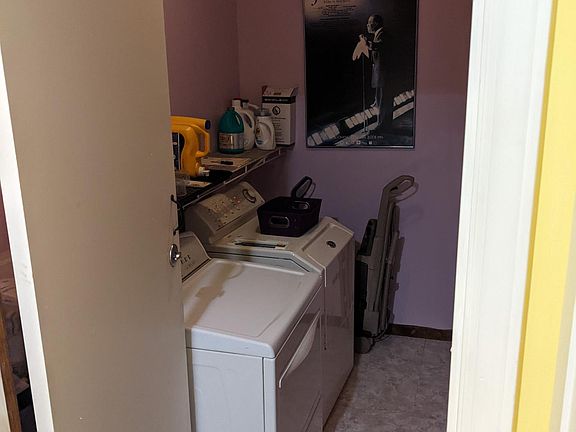 Laundry room off kitchen, connects to garage.